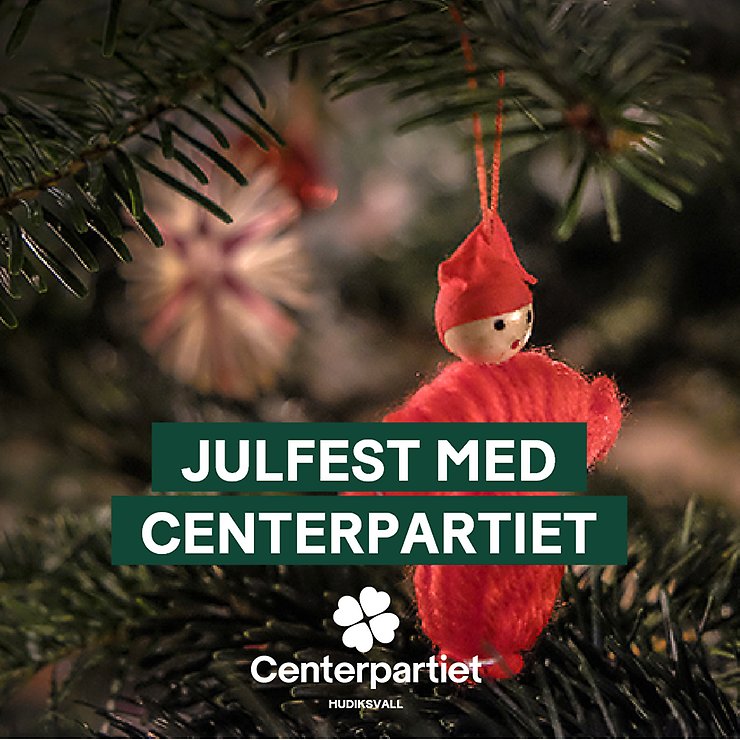 Bild på gran med ljus och kulor